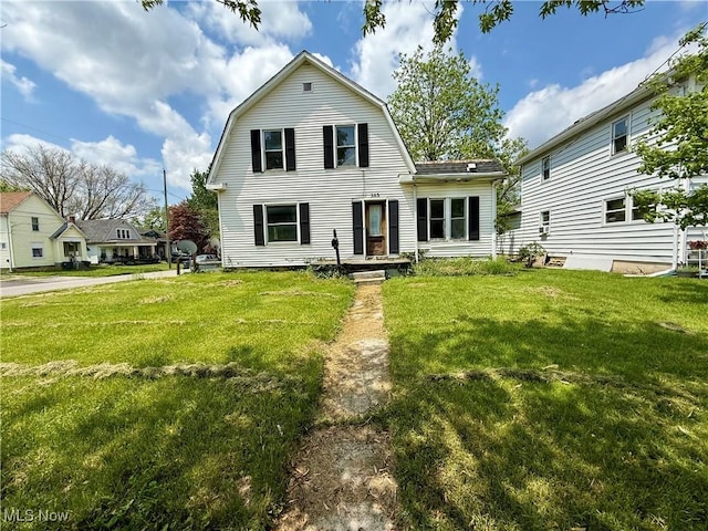 503 N Charles St, Lima, OH 45805 - view of front of house with a gambrel roof and a front yard