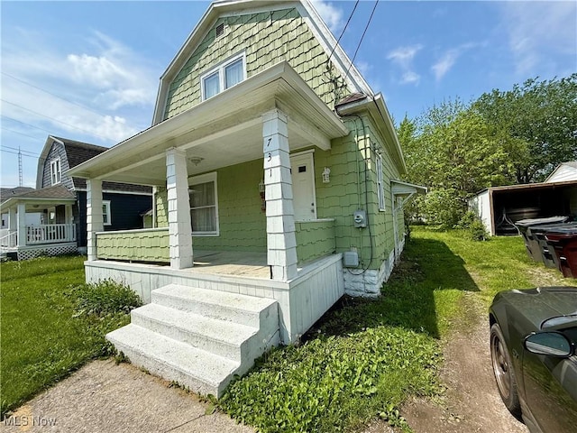 731 N Baxter St, Lima, OH 45801 - view of front of home featuring covered porch and a front yard