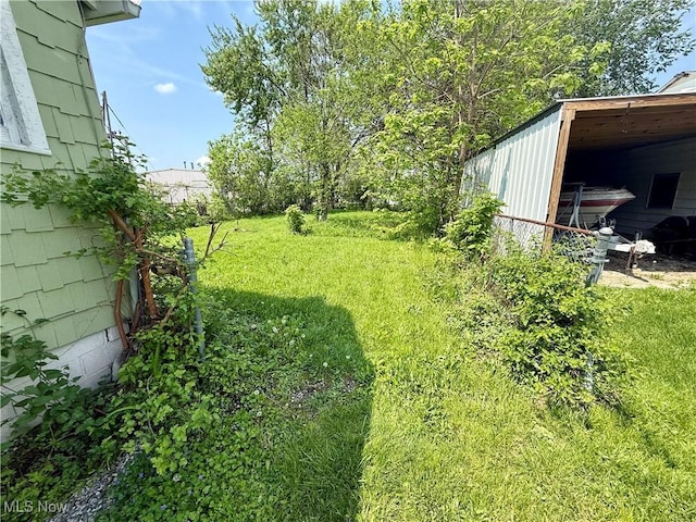 731 N Baxter St, Lima, OH 45801 - view of green lawn featuring an outbuilding