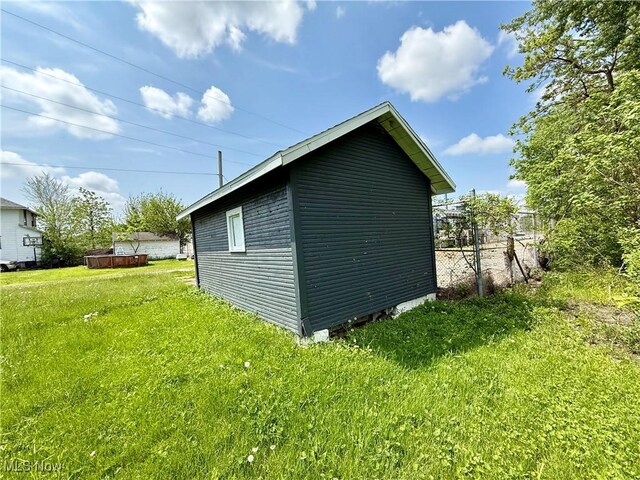 727 N Baxter St, Lima, OH 45801 - view of side of property with a yard and an outdoor structure