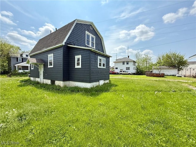 727 N Baxter St, Lima, OH 45801 - view of side of property featuring a gambrel roof and a shingled roof