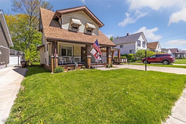4202 Walter Ave, Parma, OH 44134 - view of front facade featuring covered porch, concrete driveway, a front yard, a shingled roof, and a residential view