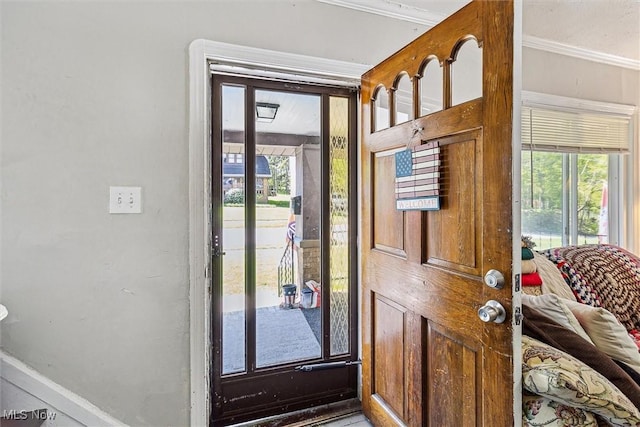 4202 Walter Ave, Parma, OH 44134 - foyer with plenty of natural light, ornamental molding, and baseboards