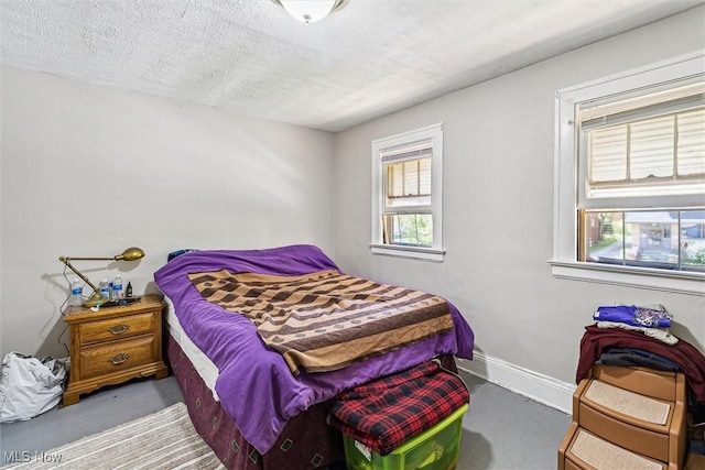4202 Walter Ave, Parma, OH 44134 - bedroom with a textured ceiling and baseboards