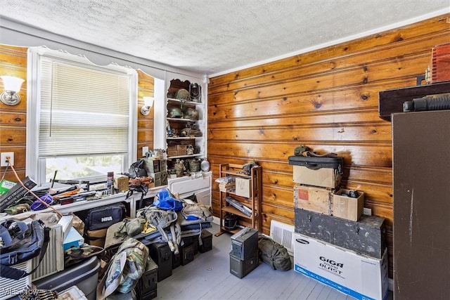 4202 Walter Ave, Parma, OH 44134 - misc room with a textured ceiling, wood finished floors, and wooden walls