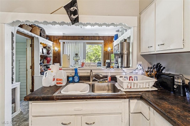 4202 Walter Ave, Parma, OH 44134 - kitchen featuring a sink, white cabinetry, and dark countertops
