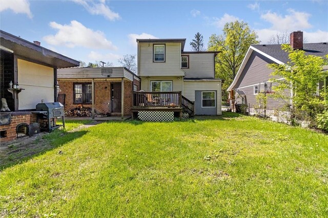 4202 Walter Ave, Parma, OH 44134 - rear view of house featuring a wooden deck and a yard