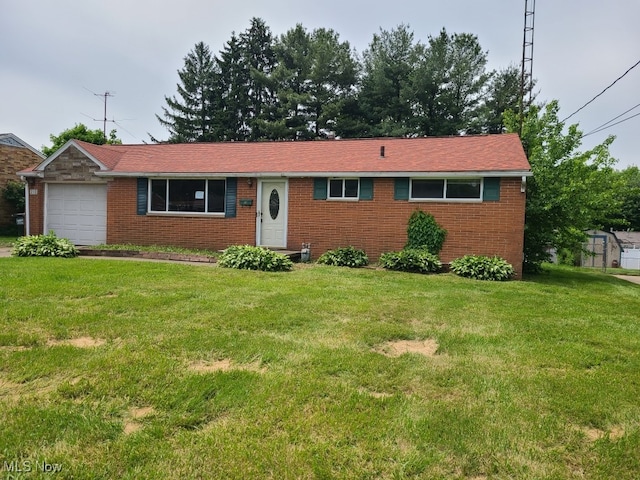 213 Fernwood Blvd, Alliance, OH 44601 - single story home with a front yard, brick siding, and a garage