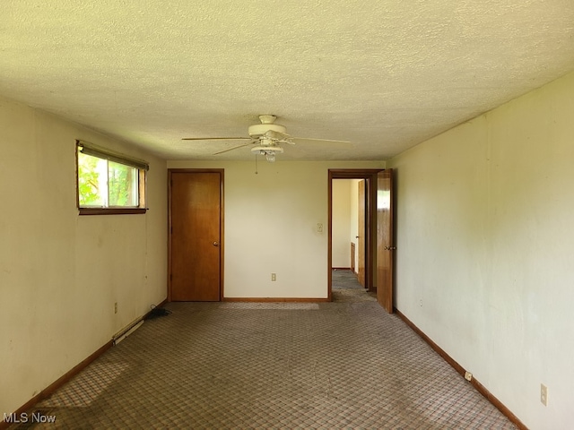 213 Fernwood Blvd, Alliance, OH 44601 - spare room with ceiling fan, a textured ceiling, baseboards, and carpet floors