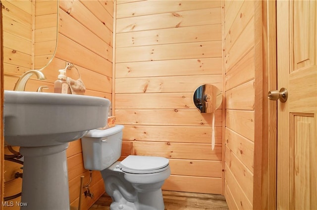 7182 Stewart Sharon Rd, Hubbard, OH 44425 - bathroom with toilet, wood walls, and wood finished floors