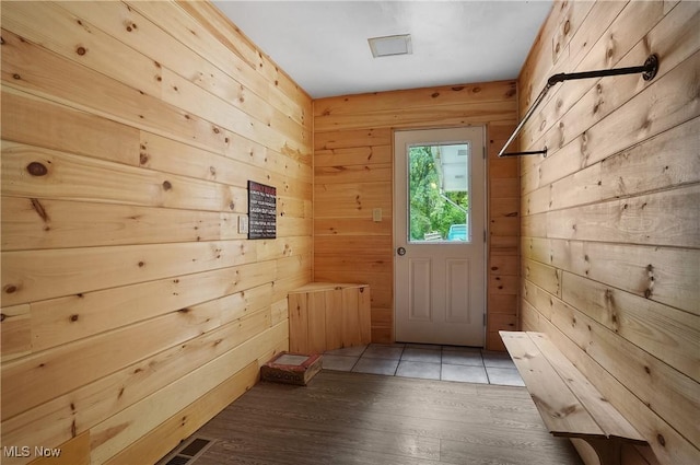 7182 Stewart Sharon Rd, Hubbard, OH 44425 - doorway to outside featuring wood walls and light wood finished floors