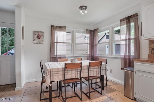 7182 Stewart Sharon Rd, Hubbard, OH 44425 - dining area with light tile patterned floors and baseboards