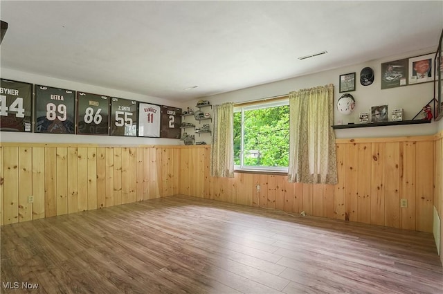 7182 Stewart Sharon Rd, Hubbard, OH 44425 - empty room featuring wood finished floors and wooden walls