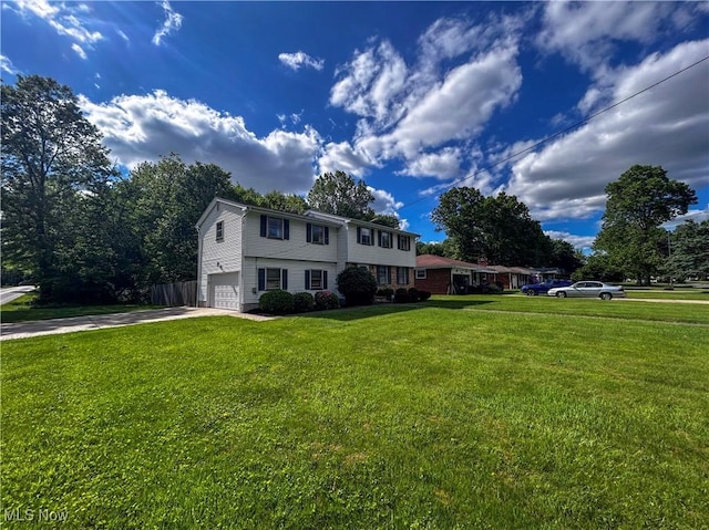 100 Chadwick Ln, Austintown, OH 44515 - colonial home with driveway, an attached garage, and a front lawn