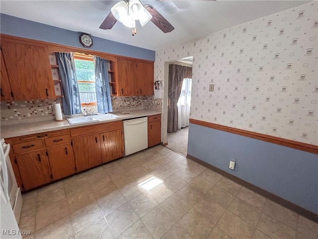 100 Chadwick Ln, Austintown, OH 44515 - kitchen featuring white dishwasher, a sink, a ceiling fan, open shelves, and brown cabinets