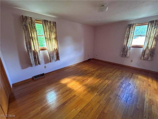 100 Chadwick Ln, Austintown, OH 44515 - unfurnished room with healthy amount of natural light, wood finished floors, and baseboards