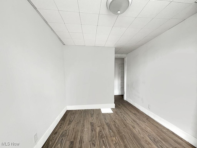 642 F St, Lorain, OH 44052 - spare room featuring dark wood-style flooring and baseboards
