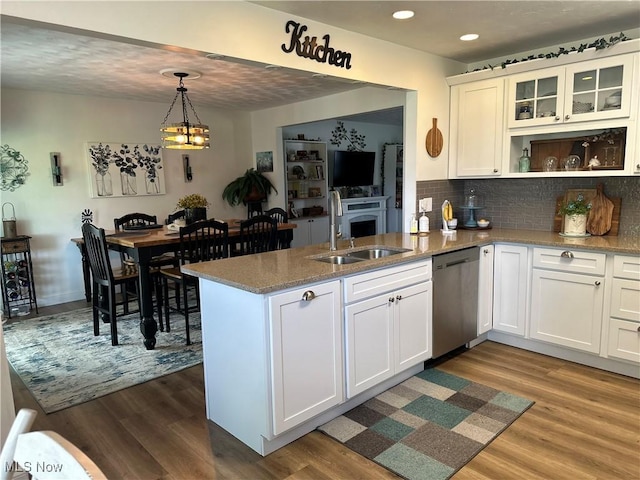 59010 Palmer St, Byesville, OH 43723 - kitchen featuring a sink, dishwasher, a peninsula, wood finished floors, and recessed lighting
