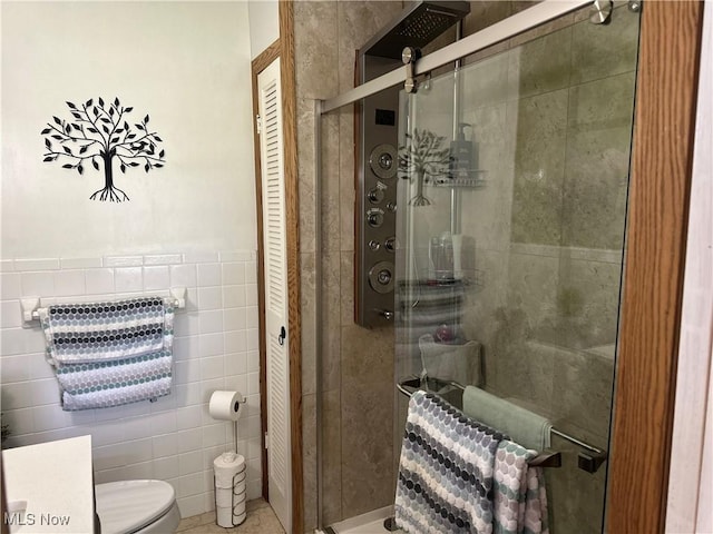 59010 Palmer St, Byesville, OH 43723 - full bath featuring tile walls, a stall shower, and toilet