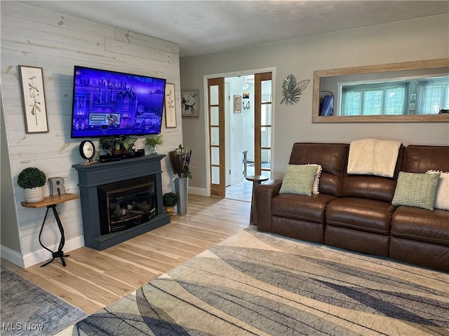 59010 Palmer St, Byesville, OH 43723 - living area with wood finished floors, baseboards, and a glass covered fireplace
