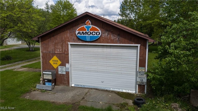 detached garage featuring driveway
