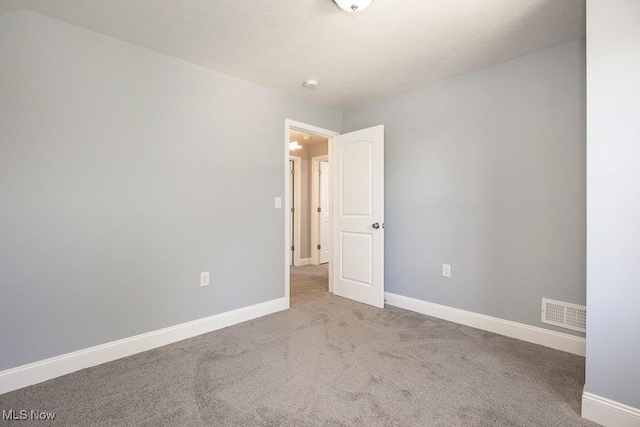2205 W 85th St, Cleveland, OH 44102 - carpeted spare room featuring baseboards and a smoke detector