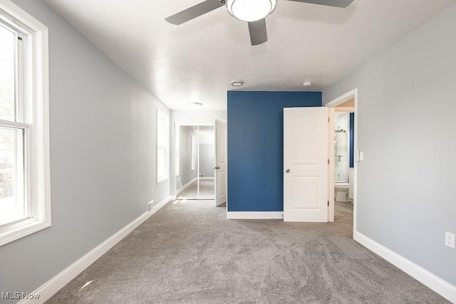 2205 W 85th St, Cleveland, OH 44102 - unfurnished bedroom featuring baseboards, carpet floors, and ceiling fan