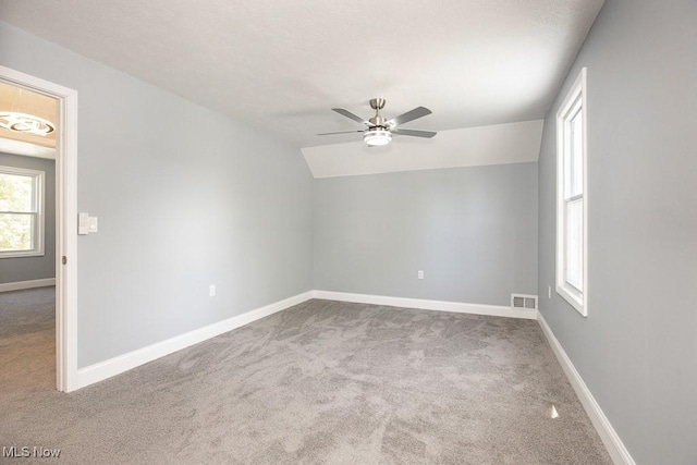 2205 W 85th St, Cleveland, OH 44102 - empty room featuring carpet flooring, ceiling fan, lofted ceiling, and baseboards