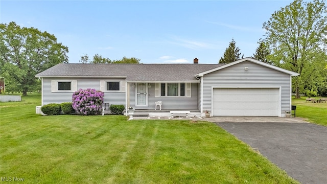 single story home featuring an attached garage, driveway, a front lawn, and a chimney