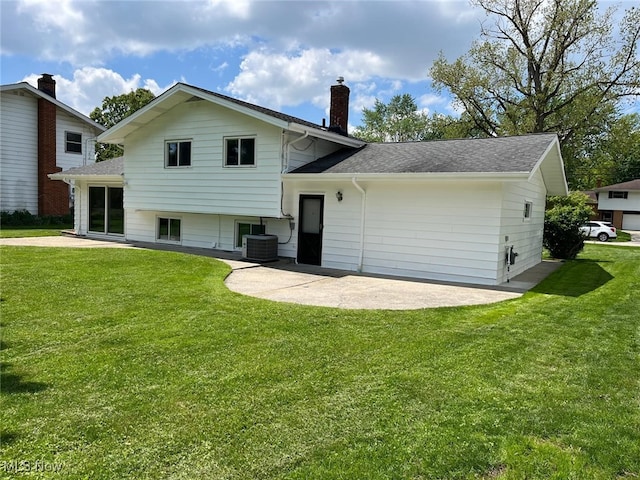 5135 Berkshire Dr, North Olmsted, OH 44070 - back of property with cooling unit, a patio, a yard, and a chimney