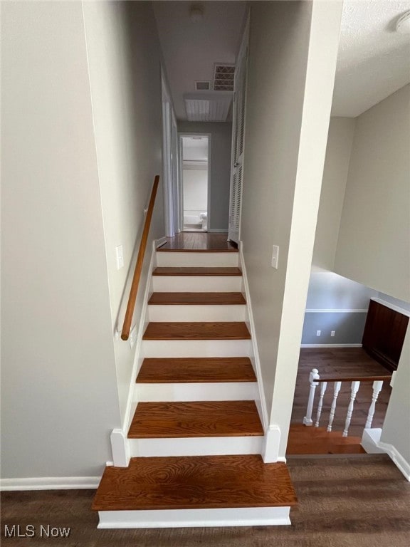 5135 Berkshire Dr, North Olmsted, OH 44070 - staircase with baseboards and wood finished floors