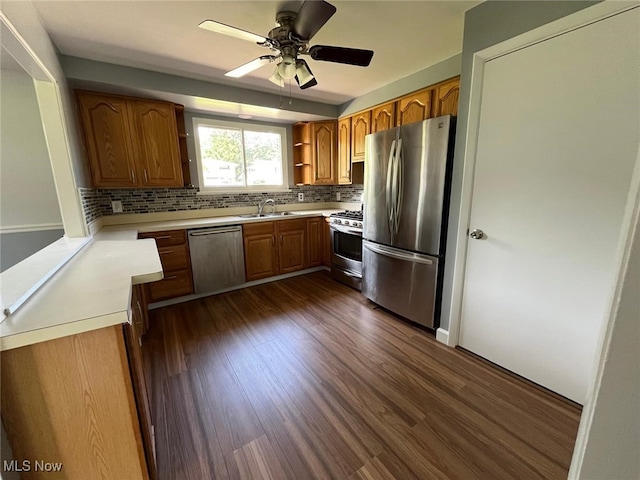 5135 Berkshire Dr, North Olmsted, OH 44070 - kitchen with stainless steel appliances, open shelves, decorative backsplash, a sink, and brown cabinets