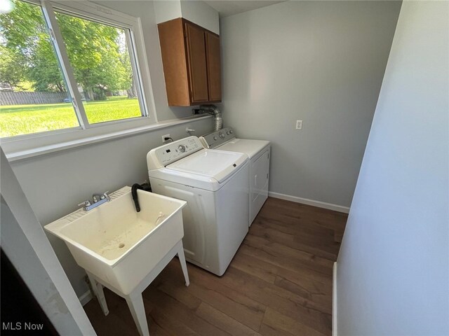 5135 Berkshire Dr, North Olmsted, OH 44070 - laundry room featuring cabinet space, washer and clothes dryer, wood finished floors, and baseboards