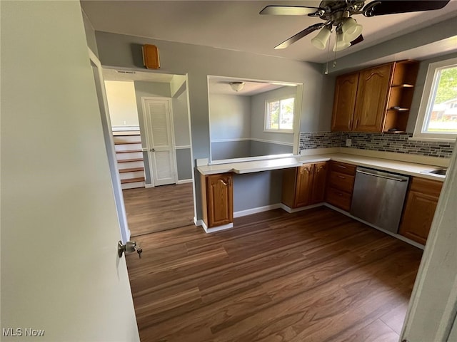 5135 Berkshire Dr, North Olmsted, OH 44070 - kitchen with dishwasher, light countertops, dark wood finished floors, decorative backsplash, and brown cabinetry