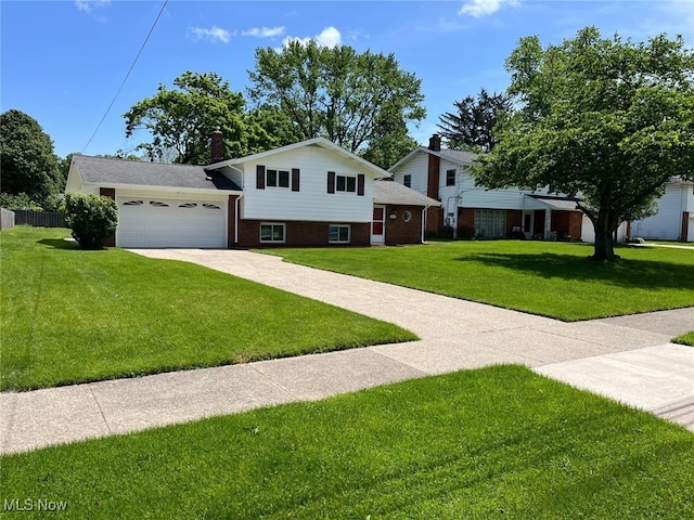 5135 Berkshire Dr, North Olmsted, OH 44070 - split level home with concrete driveway, brick siding, and a garage