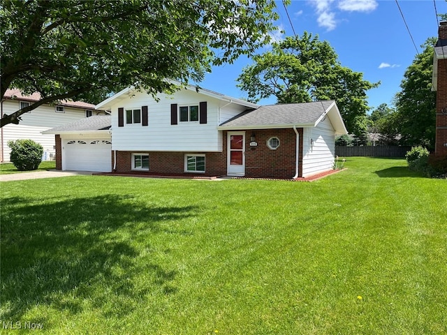 5135 Berkshire Dr, North Olmsted, OH 44070 - split level home with a garage, concrete driveway, brick siding, and a shingled roof