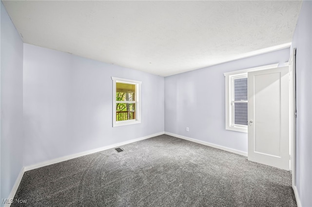 579 Main St, Conneaut, OH 44030 - carpeted spare room featuring baseboards