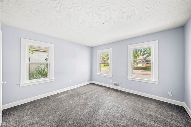 579 Main St, Conneaut, OH 44030 - spare room featuring carpet floors and baseboards