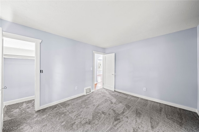 579 Main St, Conneaut, OH 44030 - unfurnished bedroom with carpet and baseboards