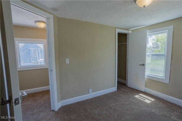 7604 Dudley Ave, Cleveland, OH 44102 - unfurnished bedroom featuring carpet, baseboards, and a closet
