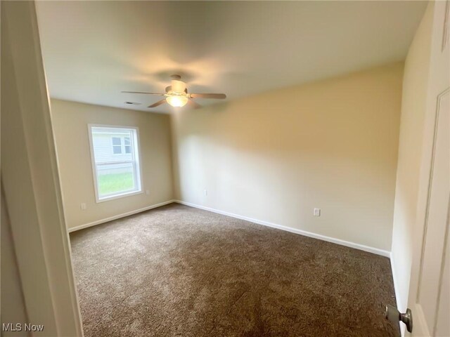 246 W Hamilton St, Oberlin, OH 44074 - unfurnished room featuring dark colored carpet, a ceiling fan, and baseboards