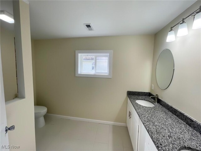 246 W Hamilton St, Oberlin, OH 44074 - bathroom with vanity, baseboards, and toilet