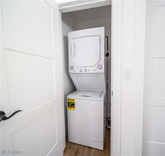 4059 Township Road 271, Killbuck, OH 44637 - laundry room featuring stacked washer / drying machine and light wood-style flooring