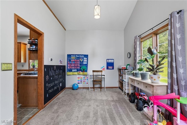 rec room featuring baseboards and carpet