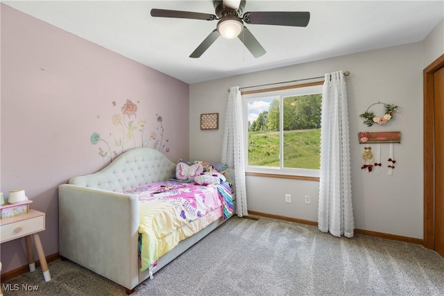 carpeted bedroom with baseboards and a ceiling fan