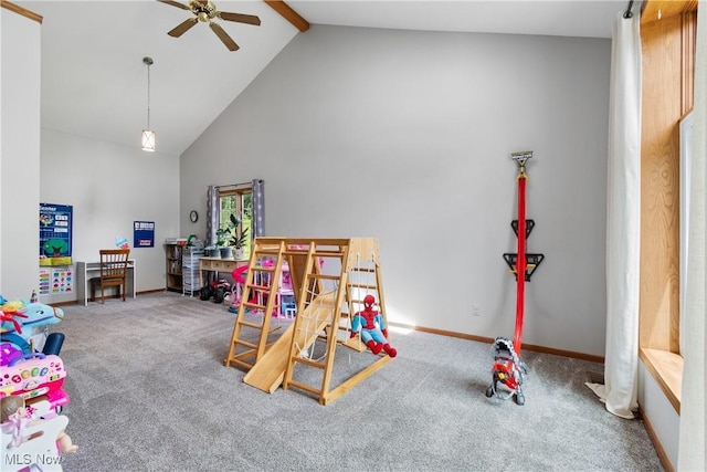 playroom with ceiling fan, carpet, beamed ceiling, high vaulted ceiling, and baseboards