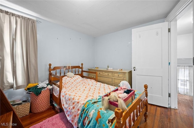 bedroom featuring hardwood / wood-style flooring