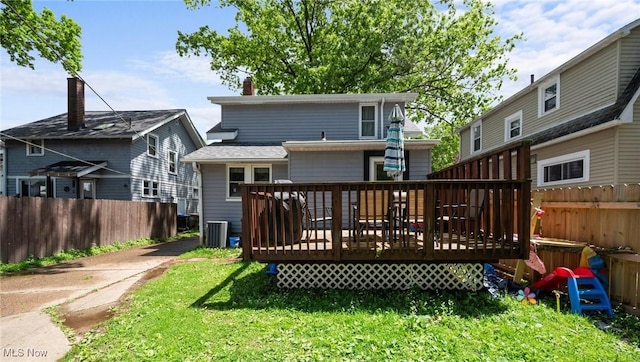 back of house with a deck and central AC unit