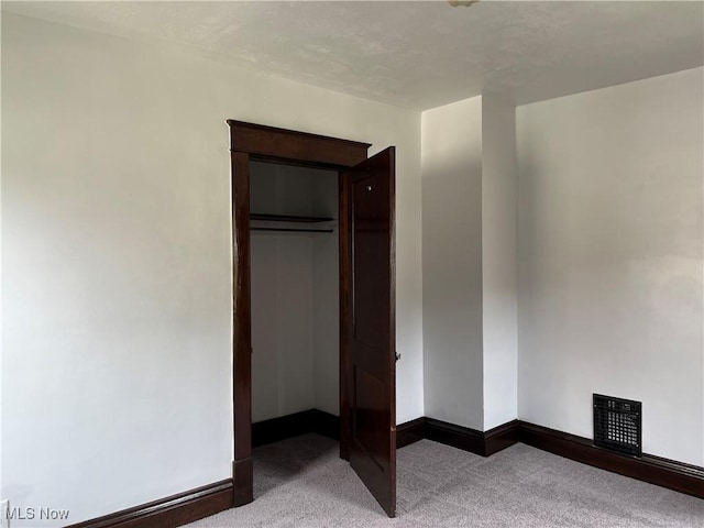 3039 W St, Weirton, WV 26062 - unfurnished bedroom featuring carpet flooring, baseboards, and a closet
