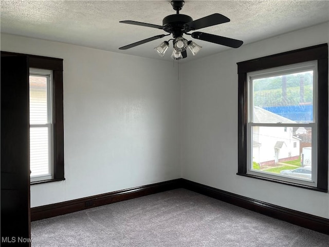3039 W St, Weirton, WV 26062 - carpeted empty room with a textured ceiling, baseboards, and a ceiling fan